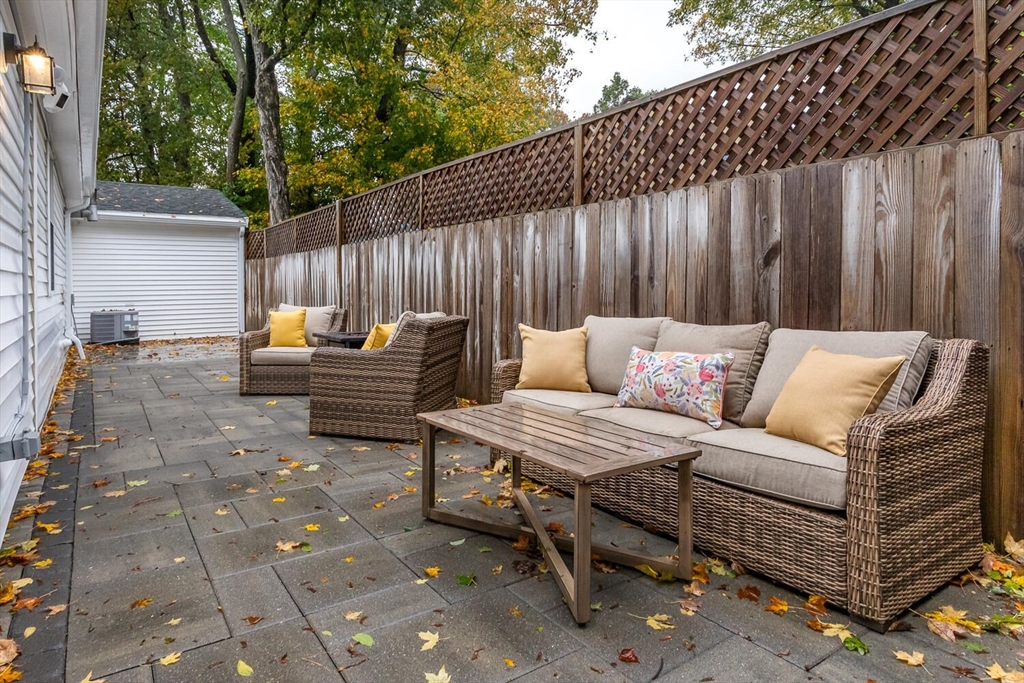 32 Billings Street, Unit 32R Sharon, MA 02067 - Photo 17 of 17 a backyard of a house with barbeque oven and outdoor seating