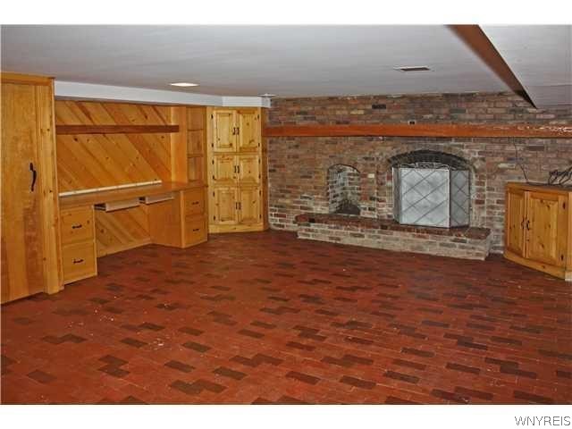 7132 Taylor Road Boston, NY 14075 - Photo 8 of 15 Basement rec room w/fp