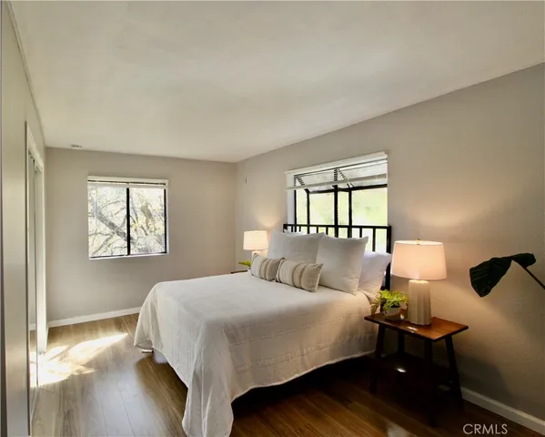 a living room with furniture and a lamp