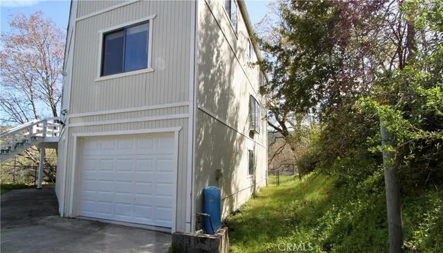 a view of a house with a tree
