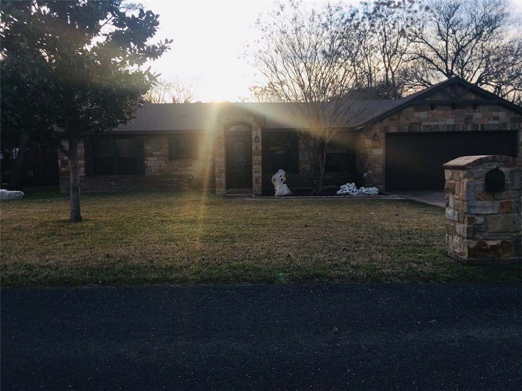a house view with a garden space