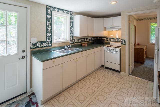 605 Pine Ridge Road Beech Mountain, NC 28604 - Photo 25 of 45 a kitchen with a sink cabinets and window
