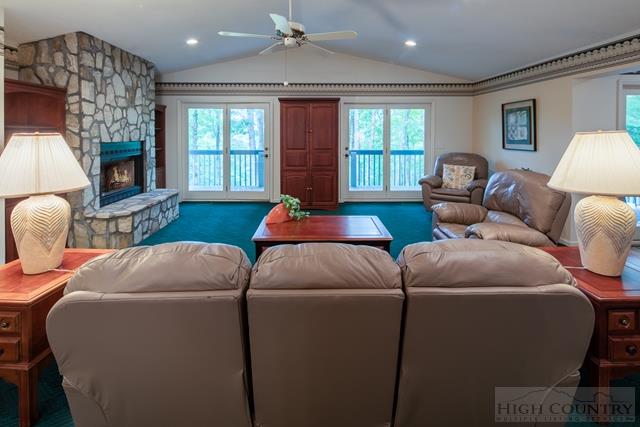 605 Pine Ridge Road Beech Mountain, NC 28604 - Photo 3 of 45 a living room with furniture a fireplace and a large window