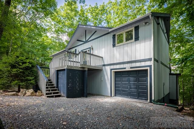 605 Pine Ridge Road Beech Mountain, NC 28604 - Photo 40 of 45 a front view of a house with a garage