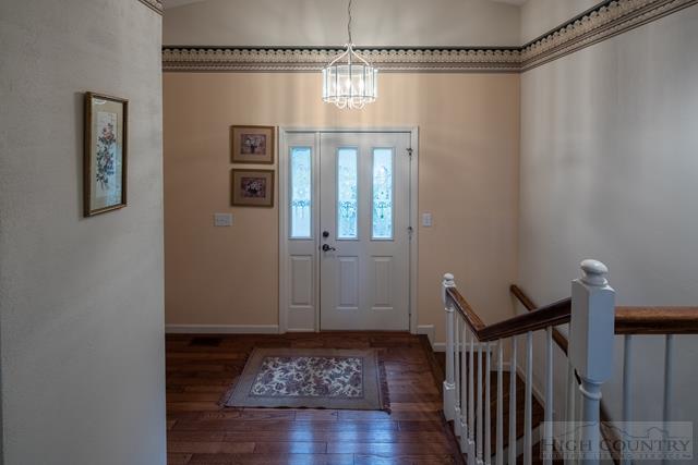 605 Pine Ridge Road Beech Mountain, NC 28604 - Photo 43 of 45 a view of a hallway with wooden floor and stairs