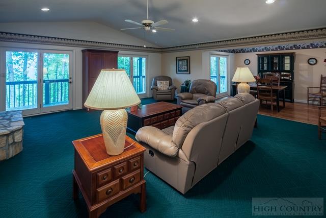 605 Pine Ridge Road Beech Mountain, NC 28604 - Photo 5 of 45 a living room with furniture and a flat screen tv