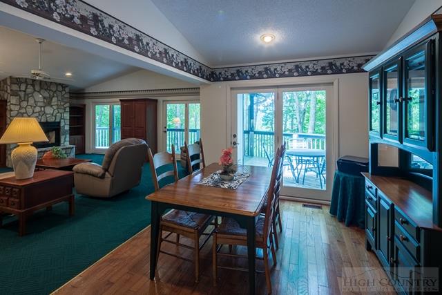 605 Pine Ridge Road Beech Mountain, NC 28604 - Photo 9 of 45 a view of a dining room with furniture window and wooden floor