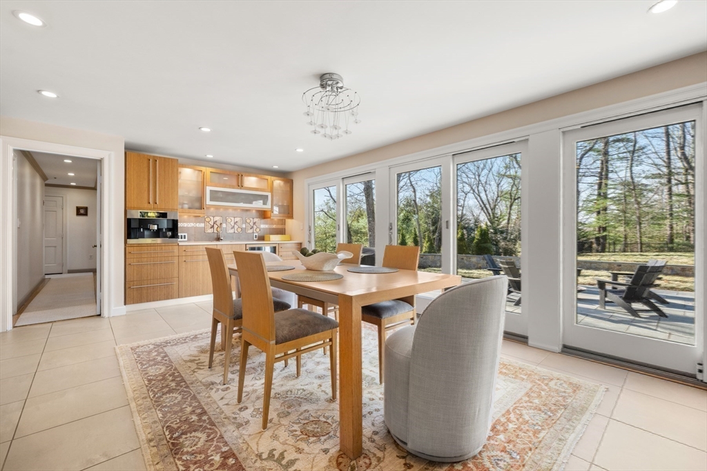 84 Royalston Road Wellesley, MA 02481 - Photo 20 of 42 a view of a dining room with furniture window and outside view