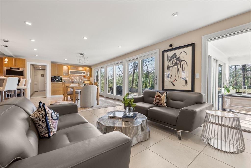 84 Royalston Road Wellesley, MA 02481 - Photo 22 of 42 a living room with furniture and a large window