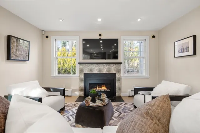 a large kitchen with stainless steel appliances granite countertop a large counter top a stove and a sink