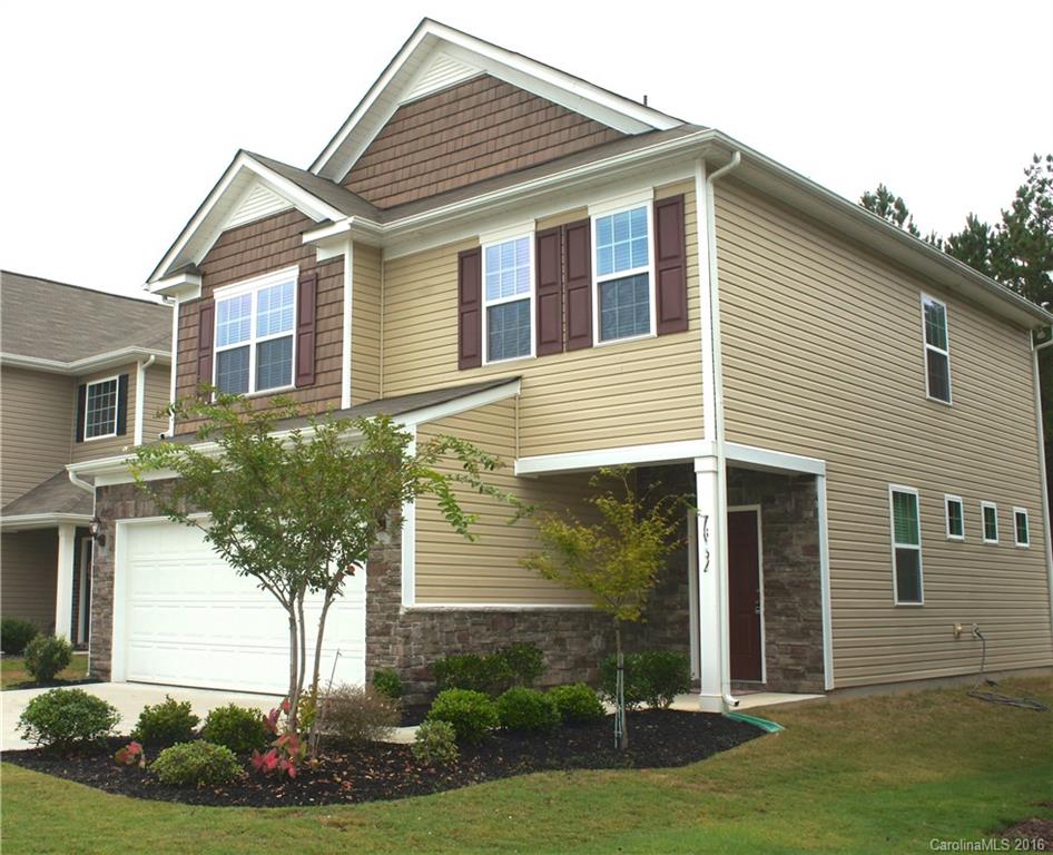 78194 Rillstone Drive, Unit 226 Lancaster, SC 29720 - Photo 2 of 19 a front view of a house with a yard