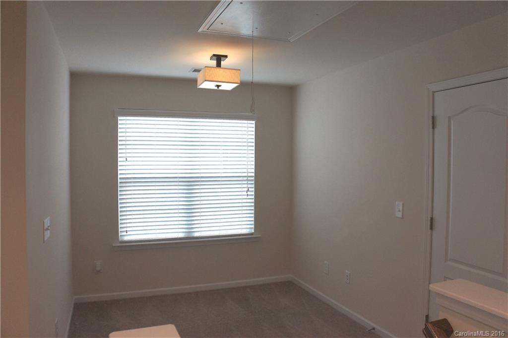 78194 Rillstone Drive, Unit 226 Lancaster, SC 29720 - Photo 11 of 19 a view of an empty room with a window