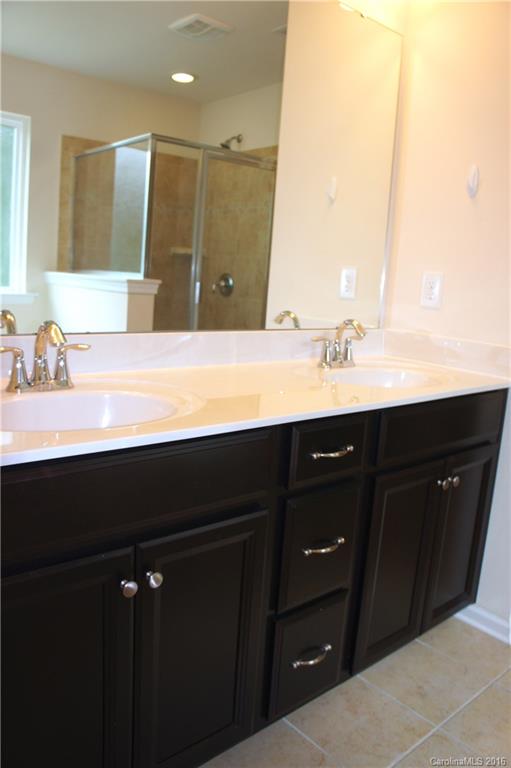78194 Rillstone Drive, Unit 226 Lancaster, SC 29720 - Photo 13 of 19 a bathroom with a sink and a mirror