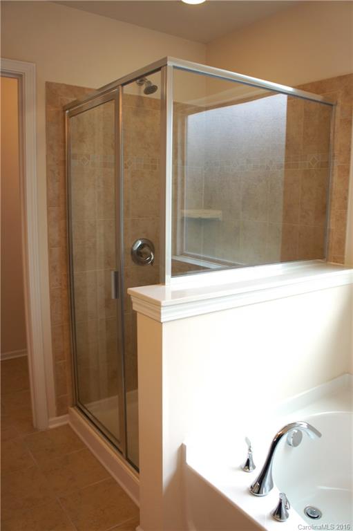 78194 Rillstone Drive, Unit 226 Lancaster, SC 29720 - Photo 14 of 19 a bathroom with a shower and a sink