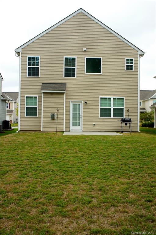 78194 Rillstone Drive, Unit 226 Lancaster, SC 29720 - Photo 15 of 19 a front view of a house with a garden