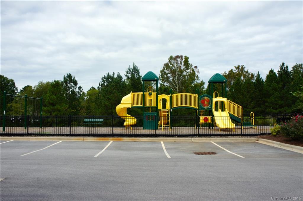 78194 Rillstone Drive, Unit 226 Lancaster, SC 29720 - Photo 17 of 19 a view of a tennis ground with large trees