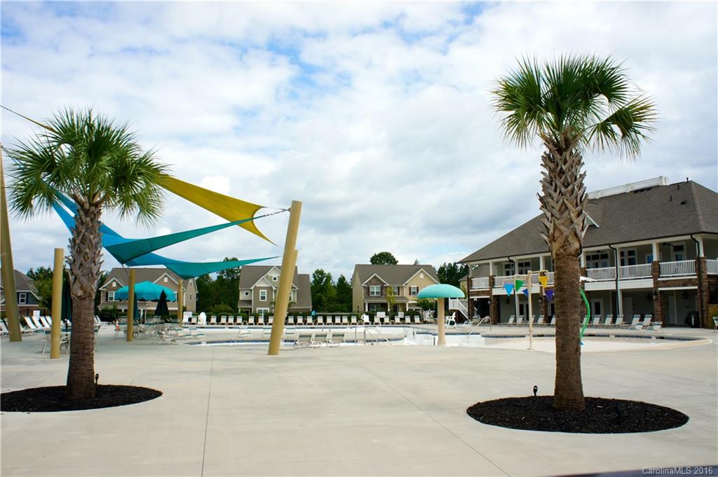 78194 Rillstone Drive, Unit 226 Lancaster, SC 29720 - Photo 18 of 19 a building with palm trees in front of it