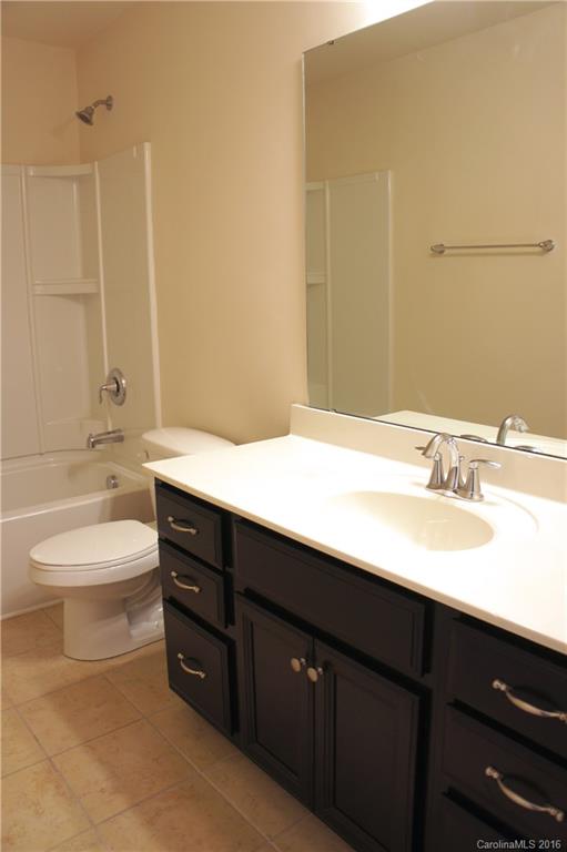 78194 Rillstone Drive, Unit 226 Lancaster, SC 29720 - Photo 10 of 19 a bathroom with a sink a toilet and a bathtub