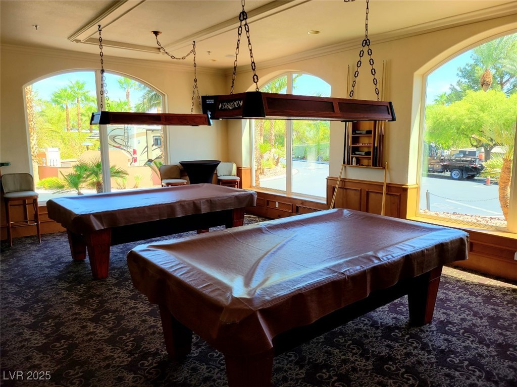 8175 Arville Street, Unit 210 Las Vegas, NV 89139 - Photo 34 of 36 Game room featuring crown molding, a wainscoted wall, pool table, and wooden walls