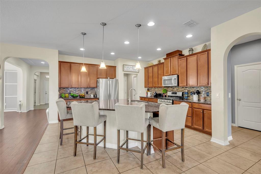 4277 Bugle Street Clermont, FL 34711 - Photo 13 of 35 a view of a dining room with furniture