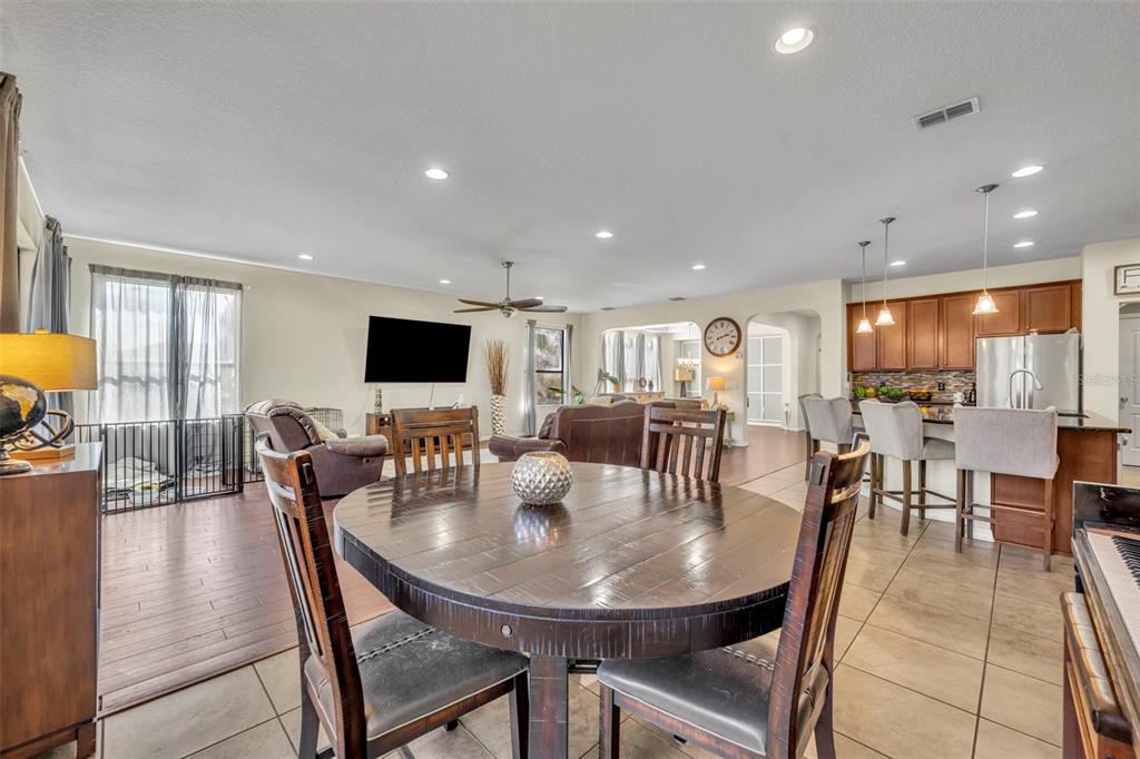 4277 Bugle Street Clermont, FL 34711 - Photo 17 of 35 a view of a dining room with furniture