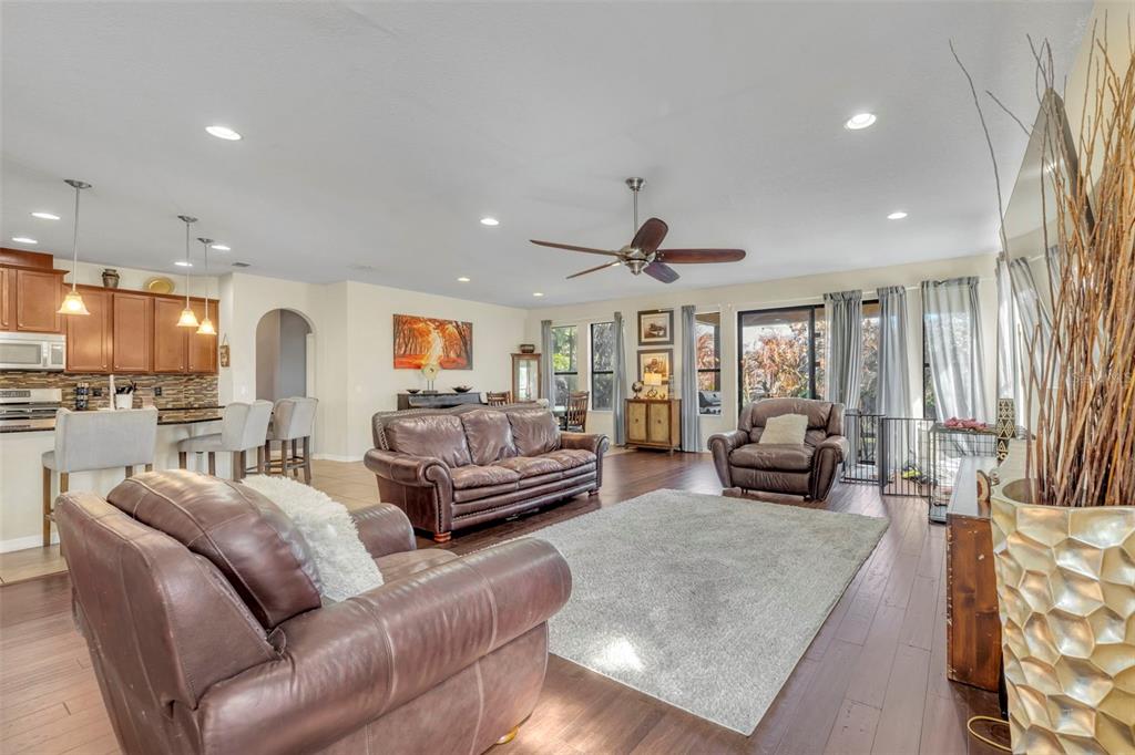 4277 Bugle Street Clermont, FL 34711 - Photo 21 of 35 a living room with furniture and a large window