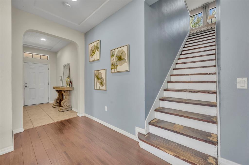 4277 Bugle Street Clermont, FL 34711 - Photo 22 of 35 a view of entryway and hall with wooden floor