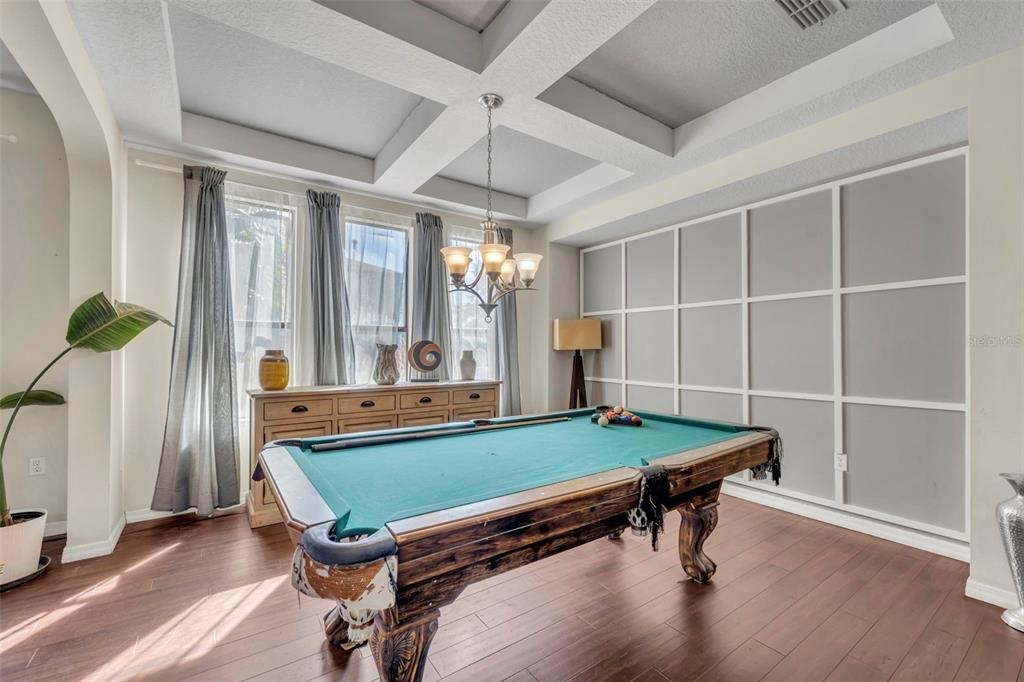 4277 Bugle Street Clermont, FL 34711 - Photo 8 of 35 a room with furniture pool table gym equipment and windows
