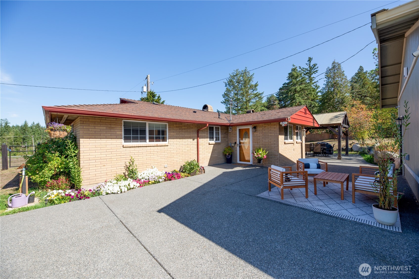 a front view of a house with garden