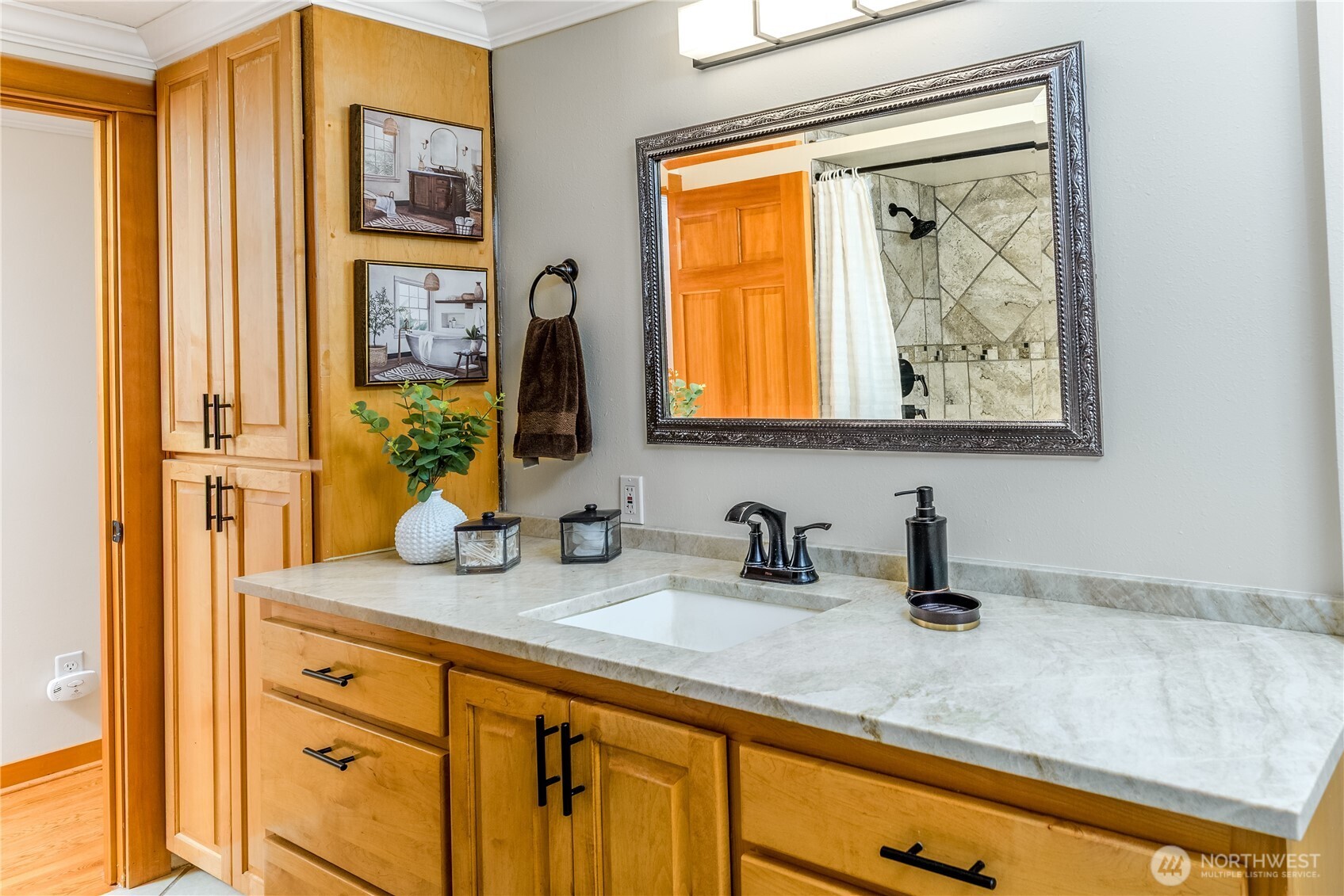 273702 Highway 101 Sequim, WA 98382 - Photo 14 of 40 a bathroom with a sink and a mirror