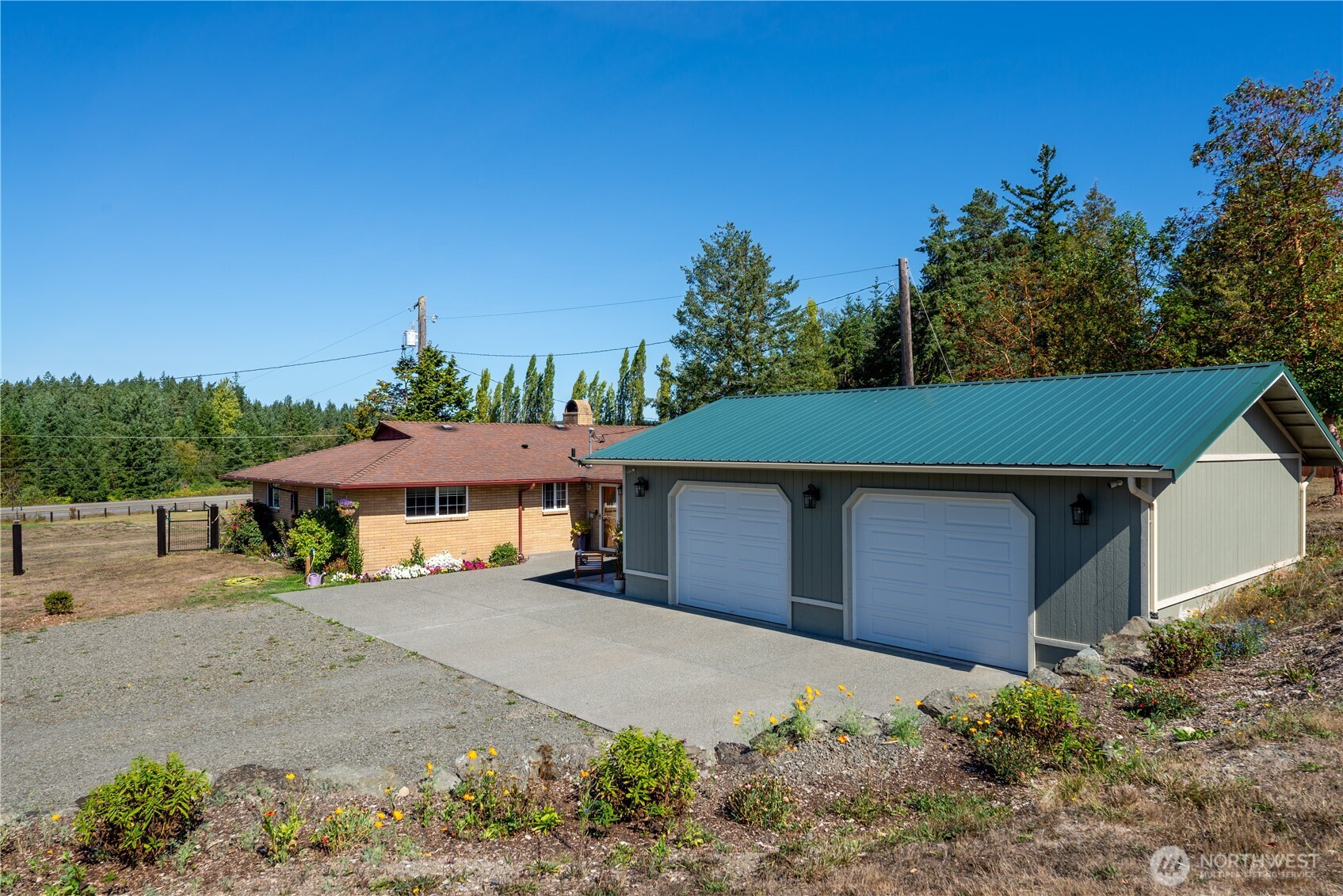 273702 Highway 101 Sequim, WA 98382 - Photo 21 of 40 front view of a house with a yard