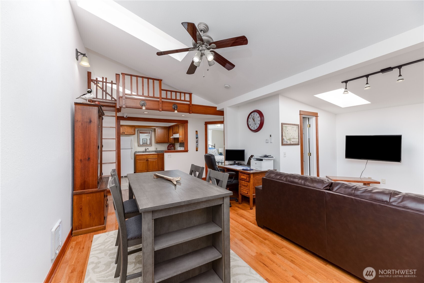273702 Highway 101 Sequim, WA 98382 - Photo 24 of 40 a living room with furniture and a flat screen tv