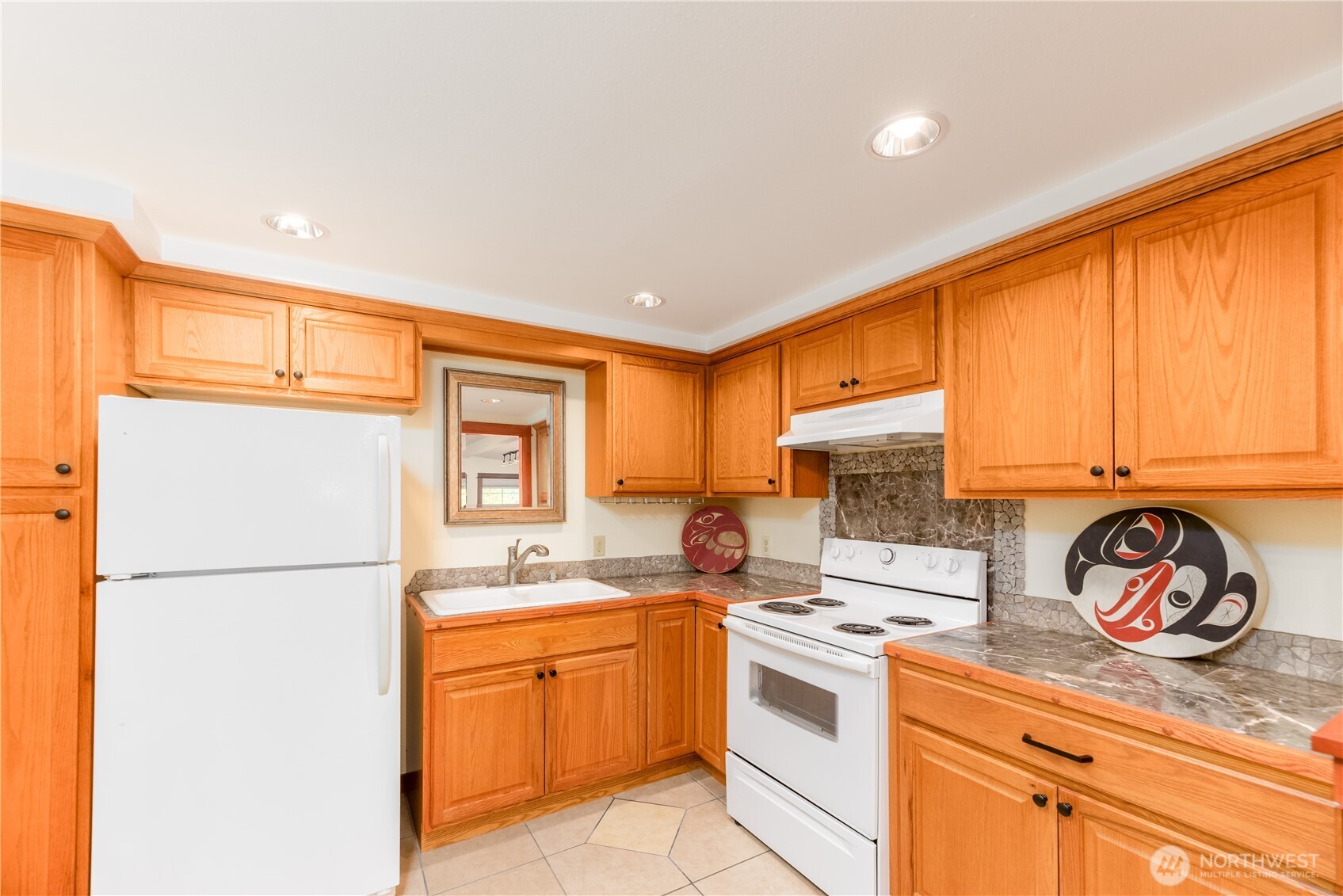 273702 Highway 101 Sequim, WA 98382 - Photo 27 of 40 a kitchen with a refrigerator and a stove