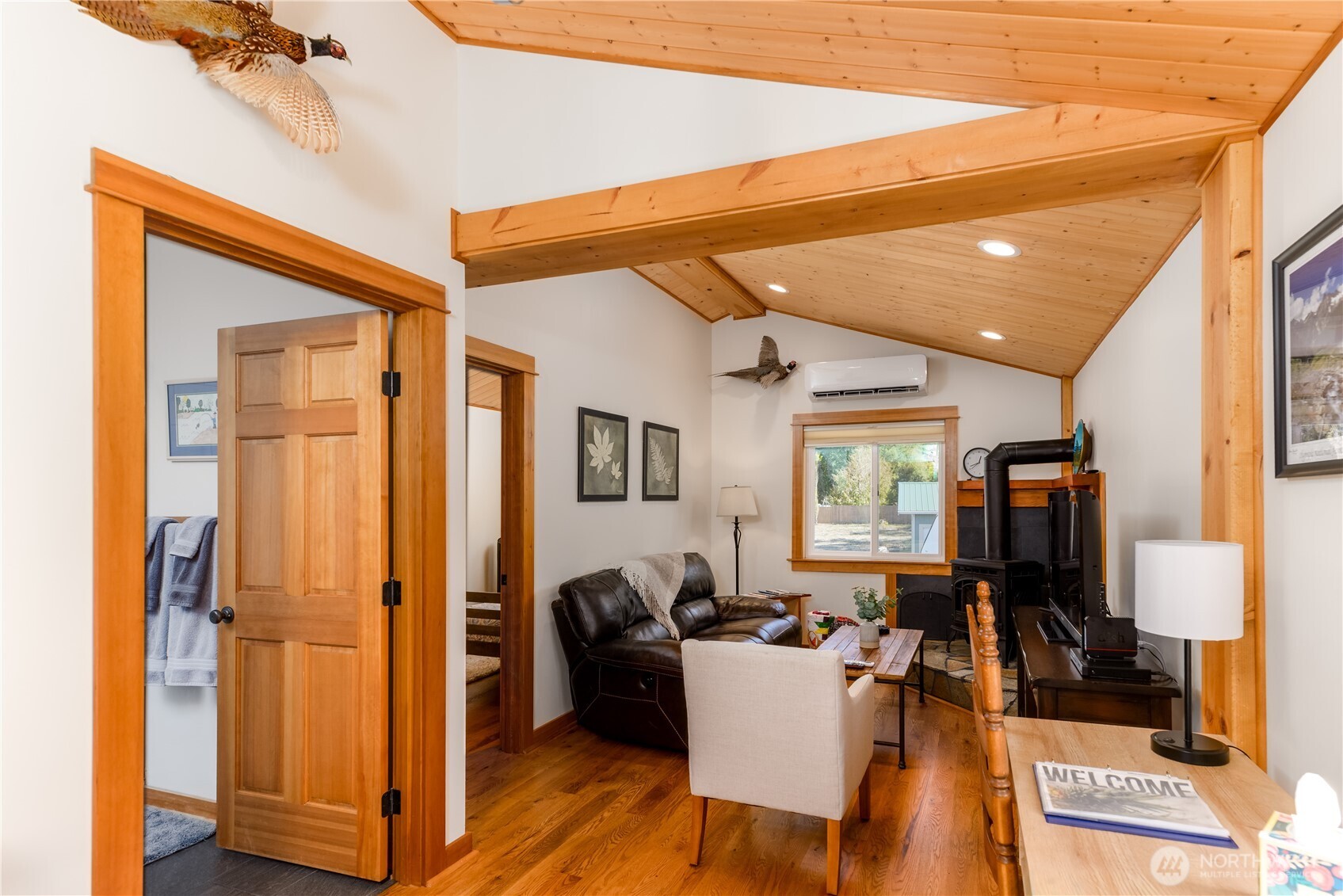 273702 Highway 101 Sequim, WA 98382 - Photo 34 of 40 a living room with furniture a window and a flat screen tv