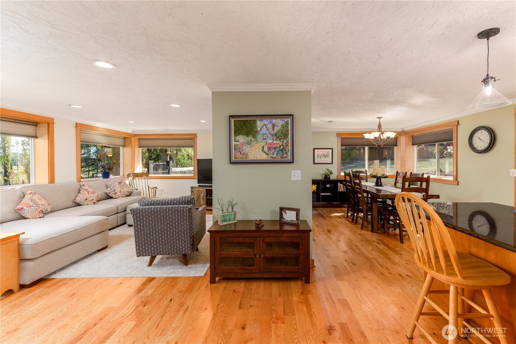 273702 Highway 101 Sequim, WA 98382 - Photo 4 of 40 a living room with furniture and wooden floor