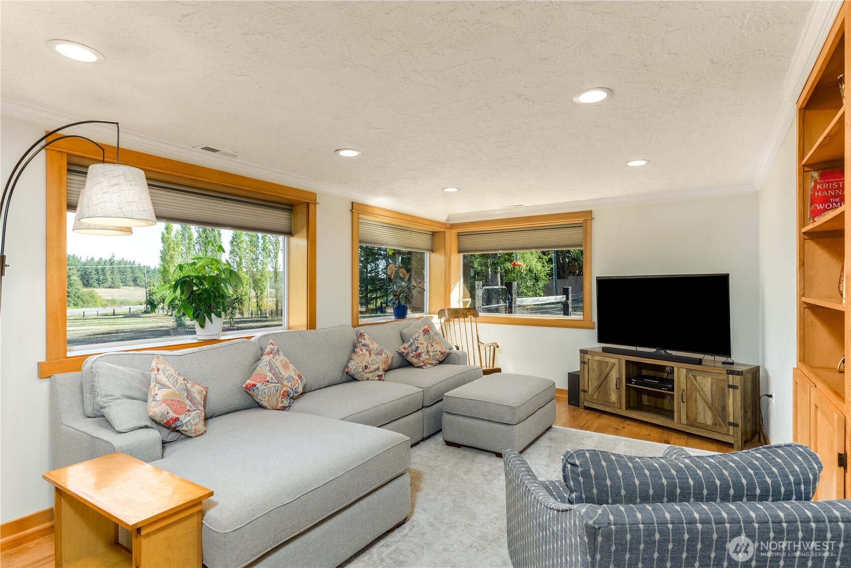 273702 Highway 101 Sequim, WA 98382 - Photo 5 of 40 a living room with furniture and a flat screen tv