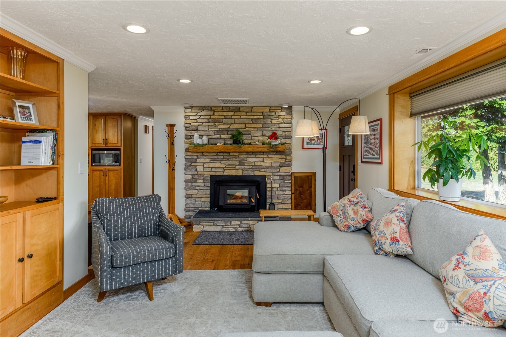273702 Highway 101 Sequim, WA 98382 - Photo 6 of 40 a living room with furniture and a fireplace
