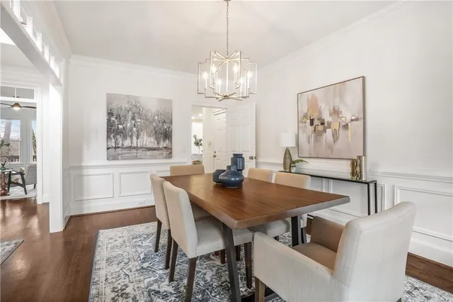 a living room with furniture a window and a potted plant