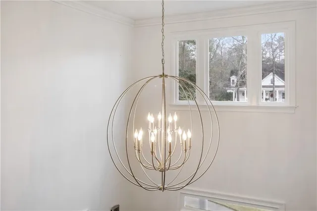 a kitchen with a sink stainless steel appliances and wooden floor