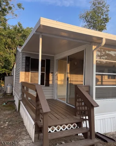 a front view of a house with glass windows