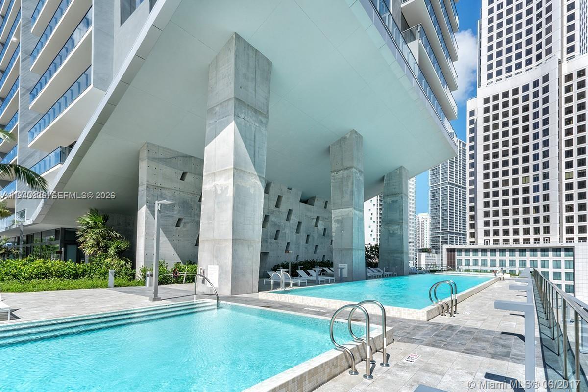 68 Southeast 6th Street, Unit 3402 Miami, FL 33131 - Photo 14 of 22 a view of a building with a patio