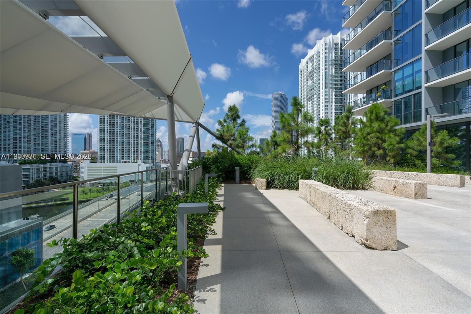 68 Southeast 6th Street, Unit 3402 Miami, FL 33131 - Photo 17 of 22 a view of a street with potted plants