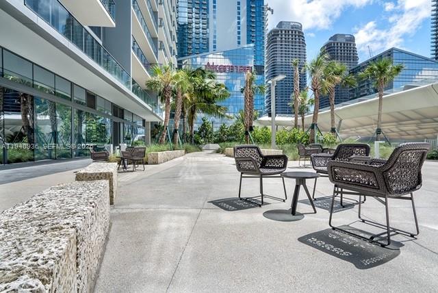 68 Southeast 6th Street, Unit 3402 Miami, FL 33131 - Photo 18 of 22 a view of a building with garden and sitting area