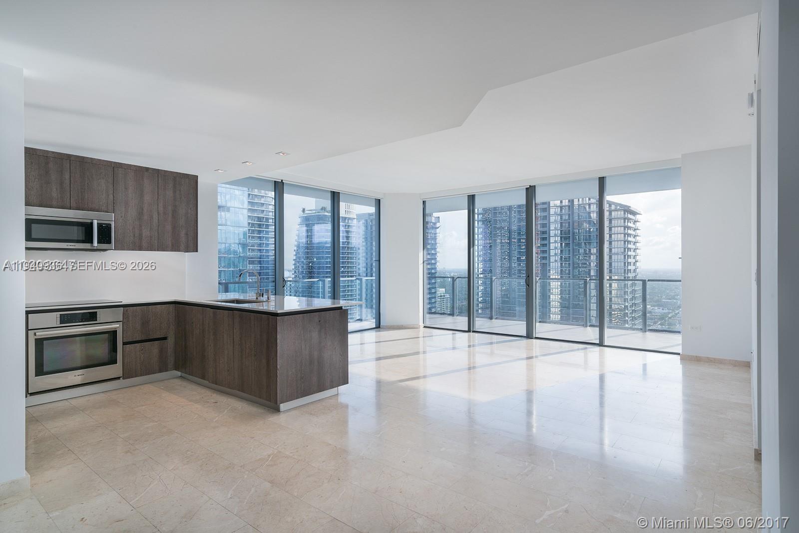 68 Southeast 6th Street, Unit 3402 Miami, FL 33131 - Photo 2 of 22 a large kitchen with a large window