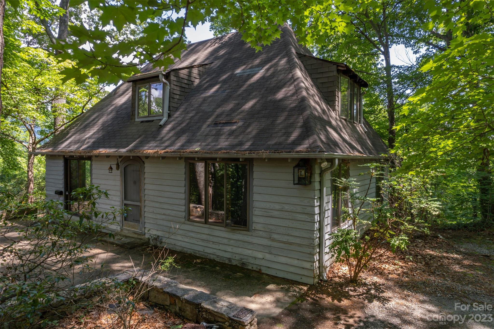 381 Wilderness Road Tryon, NC 28782 - Photo 1 of 46 a view of a house with a tree