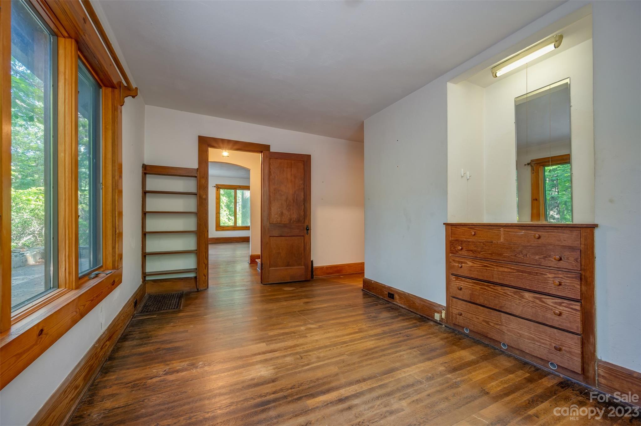 381 Wilderness Road Tryon, NC 28782 - Photo 9 of 46 wooden floor in an empty room and a window