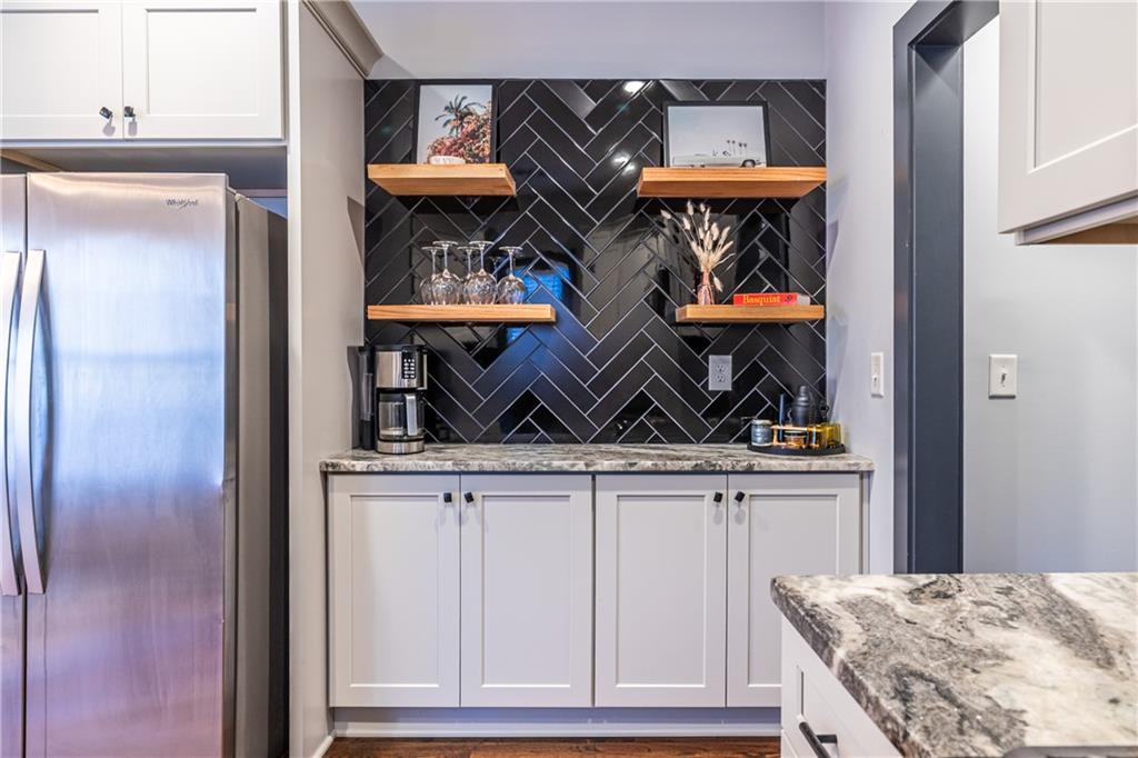 988 Mayson Turner Road Northwest Atlanta, GA 30314 - Photo 14 of 45 a view of walk in closet with clothes and shoes