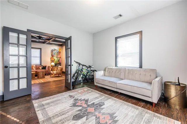 a living room with furniture and a large window