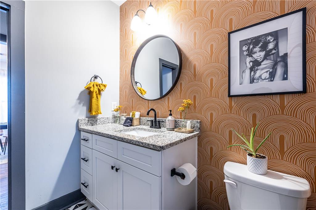 988 Mayson Turner Road Northwest Atlanta, GA 30314 - Photo 20 of 45 a bathroom with a toilet and a sink