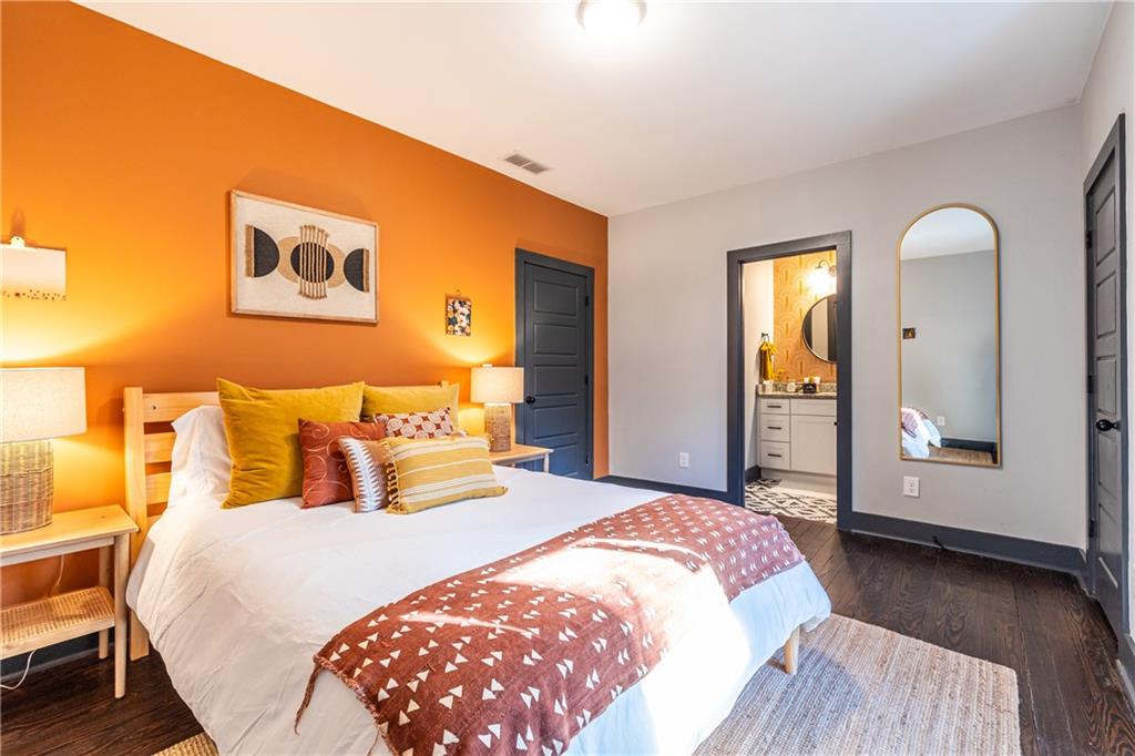 988 Mayson Turner Road Northwest Atlanta, GA 30314 - Photo 24 of 45 a bedroom with a bed and a mirror